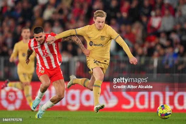 Frenkie de Jong of FC Barcelona battles for possession with Chumi of UD Almeria during the LaLiga Santander match between UD Almeria and FC Barcelona...