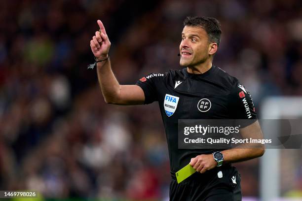 Referee Jesus Gil Manzano reacts during the LaLiga Santander match between Real Madrid CF and Atletico de Madrid at Estadio Santiago Bernabeu on...