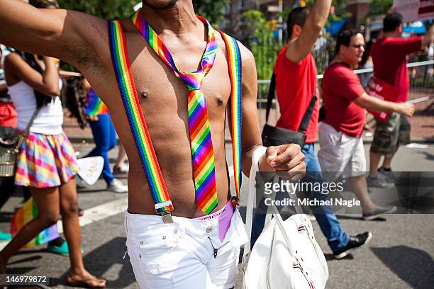 Man wears matching rainbow suspenders and tie during the New York City Gay Pride March on June 24, 2012 in New York City. The annual civil rights...