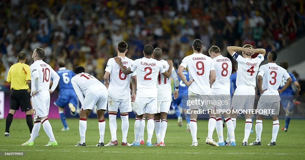 Members of the English squad react after