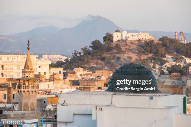 hammouda pacha mosque and tunis medina at sunset - tunis stock pictures, royalty-free photos & images