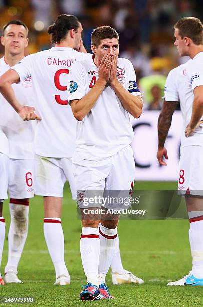 Steven Gerrard of England looks dejected after defeat in the penalty shoot out during the UEFA EURO 2012 quarter final match between England and...