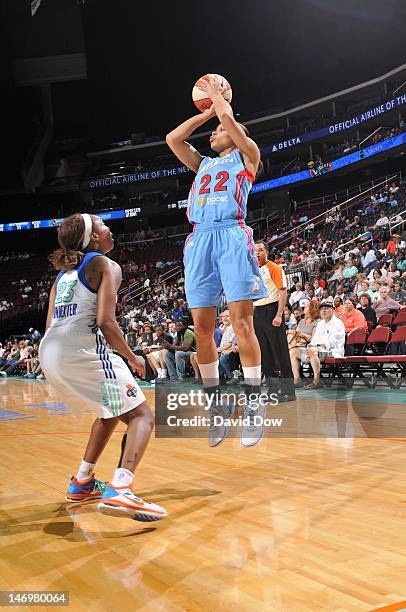 Armintie Price of the Atlanta Dream shoots the basketball against Cappie Pondexter of the New York Liberty during the WNBA game on June 24, 2012 at...