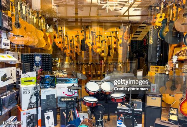 looking through music store window - music shop stock pictures, royalty-free photos & images