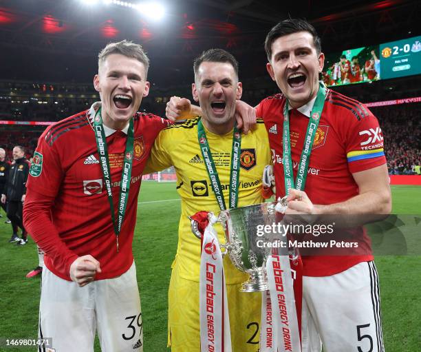 Scott McTominay, Tom Heaton, Harry Maguire of Manchester United celebrate with the trophy after the Carabao Cup Final match between Manchester United...