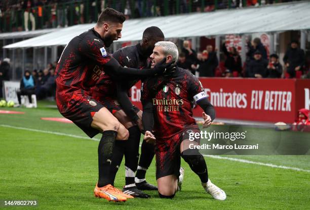 Theo Hernandez of AC Milan celebrates with teammates after their shot is deflected into the goal by Juan Musso of Atalanta BC which results in the...