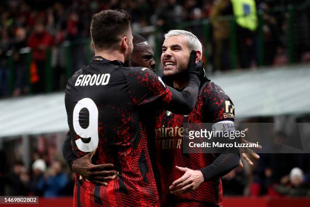 Theo Hernandez of AC Milan celebrates with teammates after their shot is deflected into the goal by Juan Musso of Atalanta BC which results in the...