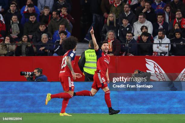 David Garcia of CA Osasuna celebrates after scoring the team's first goal with teammate Aridane during the LaLiga Santander match between Sevilla FC...