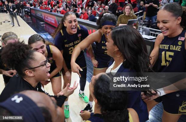 The Notre Dame Fighting Irish celebrate after the 68-65 win over theLouisville Cardinals against the at KFC YUM! Center on February 26, 2023 in...