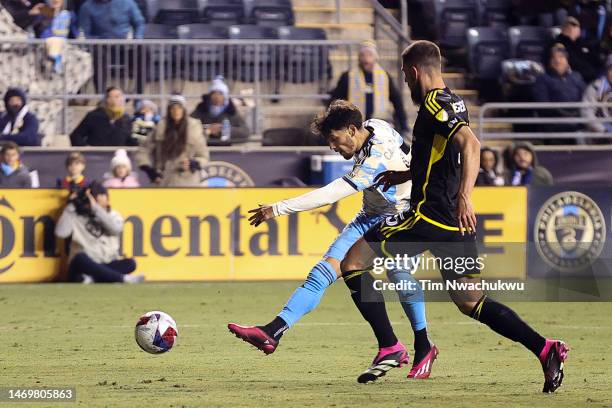 Julián Carranza of Philadelphia Union shoots to score past Miloš Degenek of Columbus Crew during the second half at Subaru Park on February 25, 2023...