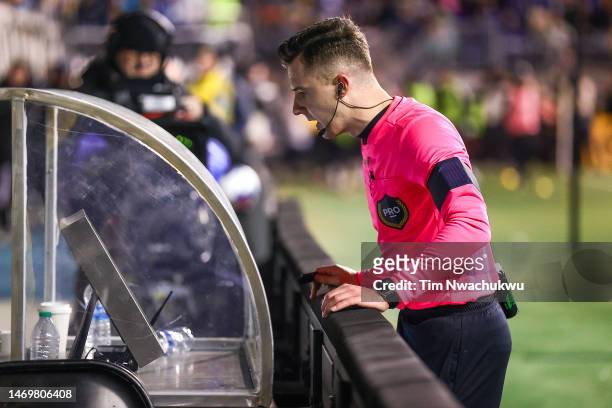 Referee Lukasz Szpala reviews a VAR decision during the second half between Philadelphia Union and Columbus Crew at Subaru Park on February 25, 2023...