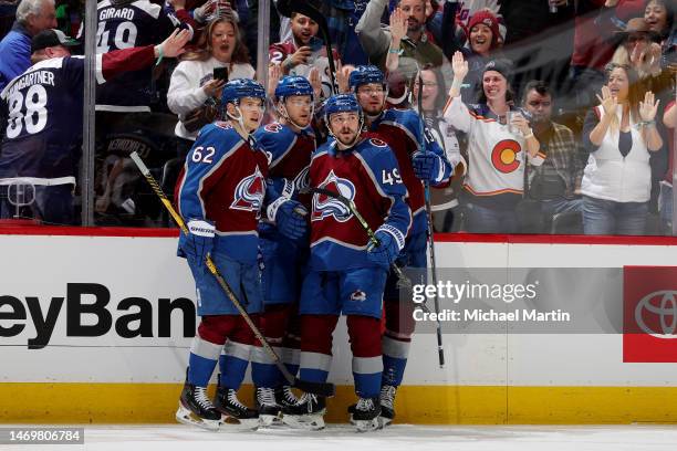 Artturi Lehkonen, Nathan MacKinnon, Valeri Nichushkin and Samuel Girard of the Colorado Avalanche celebrate a goal against the Calgary Flames at Ball...