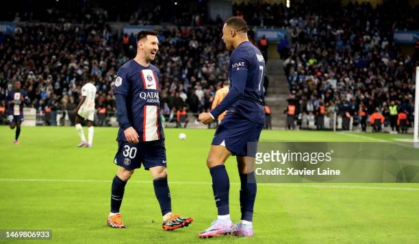 Kylian Mbappe of Paris Saint-Germain celebrate his first goal with Lionel Messi during the Ligue 1 match between Olympique Marseille and Paris...