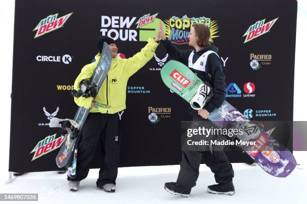Third place winner Raibu Katayama of Team Japan high fives second place winner Taylor Gold of Team United States after the Men’s Snowboard Superpipe...