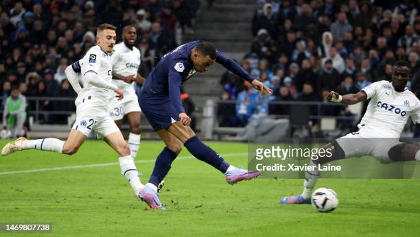 Kylian Mbappe of Paris Saint-Germain scores his first goal during the Ligue 1 match between Olympique Marseille and Paris Saint-Germain at Orange...