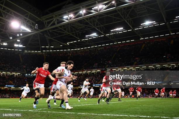 Henry Arundell of England is tackled by Nick Tompkins of Wales during the Six Nations Rugby match between Wales and England at Principality Stadium...