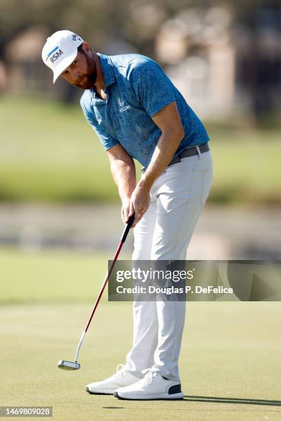 Chris Kirk of the United States putts on the 8th hole during the final round of The Honda Classic at PGA National Resort And Spa on February 26, 2023...