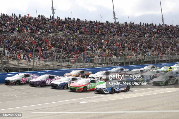 Christopher Bell, driver of the Sirius XM Toyota, Ricky Stenhouse Jr, driver of the Ralphs/Tree Top Chevrolet, Joey Logano, driver of the AAA...