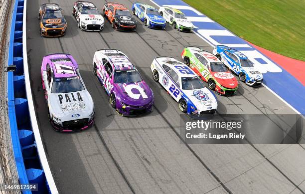 Christopher Bell, driver of the Sirius XM Toyota, Ricky Stenhouse Jr, driver of the Ralphs/Tree Top Chevrolet, Joey Logano, driver of the AAA...