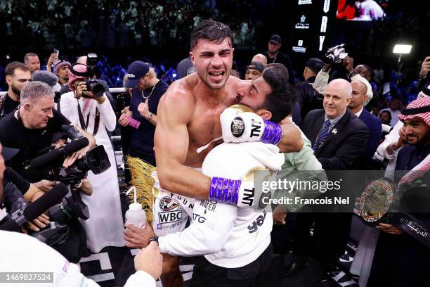 Tommy Fury celebrates with their team after defeating Jake Paul during the Cruiserweight Title fight between Jake Paul and Tommy Fury at the Diriyah...