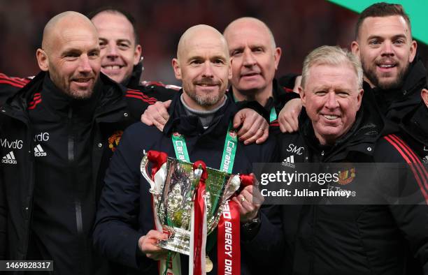Erik ten Hag , Manager of Manchester United, Assistant Managers, Mitchell van der Gaag and Steve McClaren celebrate with the Carabao Cup trophy...