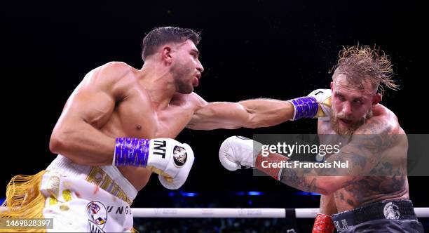 Tommy Fury punches Jake Paul during the Cruiserweight Title fight between Jake Paul and Tommy Fury during the Cruiserweight Title fight between Jake...