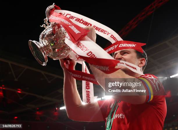 Harry Maguire of Manchester United celebrates with the Carabao Cup trophy following victory in the Carabao Cup Final match between Manchester United...