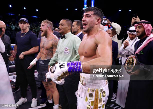 Tommy Fury celebrates as the result declares them the victor as Jake Paul looks dejected after the Cruiserweight Title fight between Jake Paul and...
