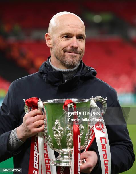 Erik ten Hag, Manager of Manchester United, celebrates with the Carabao Cup trophy following victory in the Carabao Cup Final match between...