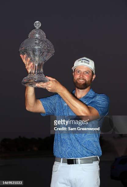 Chris Kirk of the United States stands with the trophy after winning The Honda Classic at PGA National Resort And Spa on February 26, 2023 in Palm...