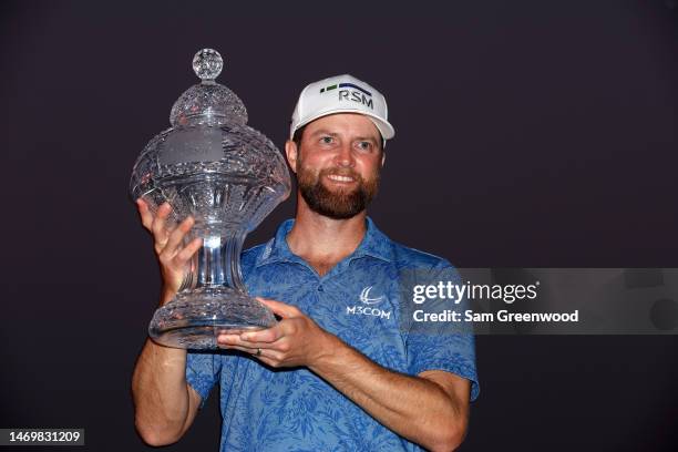 Chris Kirk of the United States stands with the trophy after winning The Honda Classic at PGA National Resort And Spa on February 26, 2023 in Palm...