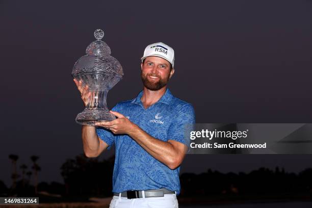 Chris Kirk of the United States stands with the trophy after winning The Honda Classic at PGA National Resort And Spa on February 26, 2023 in Palm...