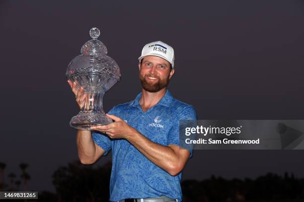 Chris Kirk of the United States stands with the trophy after winning The Honda Classic at PGA National Resort And Spa on February 26, 2023 in Palm...