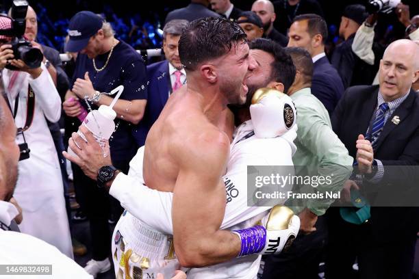 Tommy Fury celebrates with their coaching team after defeating Jake Paul during the Cruiserweight Title fight between Jake Paul and Tommy Fury at the...