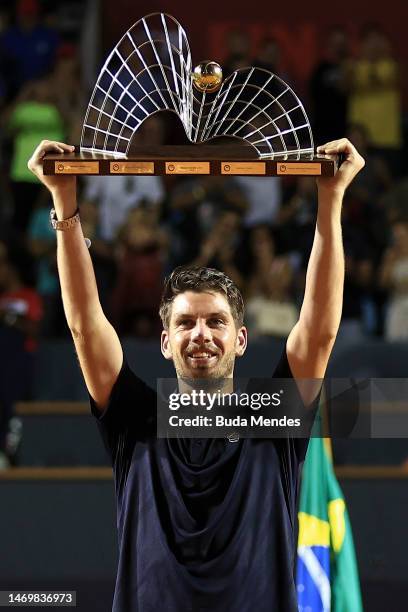 Cameron Norrie of Great Britain celebrates with the winner's trophy after winning the final match against Carlos Alcaraz of Spain of ATP 500 Rio Open...