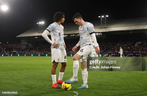 Trent Alexander-Arnold and Andrew Robertson of Liverpool prepare a free kick during the Premier League match between Crystal Palace and Liverpool FC...