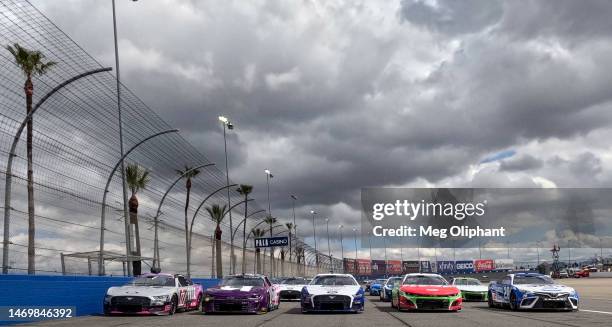 Christopher Bell, driver of the Sirius XM Toyota, Ricky Stenhouse Jr, driver of the Ralphs/Tree Top Chevrolet, Joey Logano, driver of the AAA...