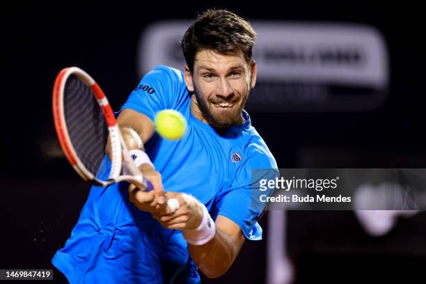 Cameron Norrie of Great Britain returns a shot to Carlos Alcaraz of Spain during the final day of ATP 500 Rio Open presented by Claro at Jockey Club...
