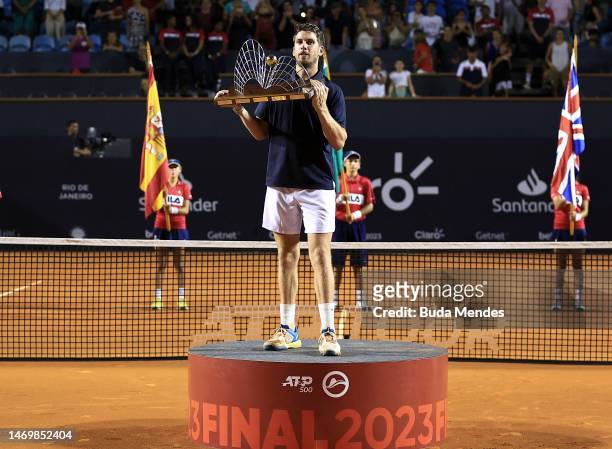 Cameron Norrie of Great Britain celebrates with the winner's trophy after winning the final match against Carlos Alcaraz of Spain of ATP 500 Rio Open...