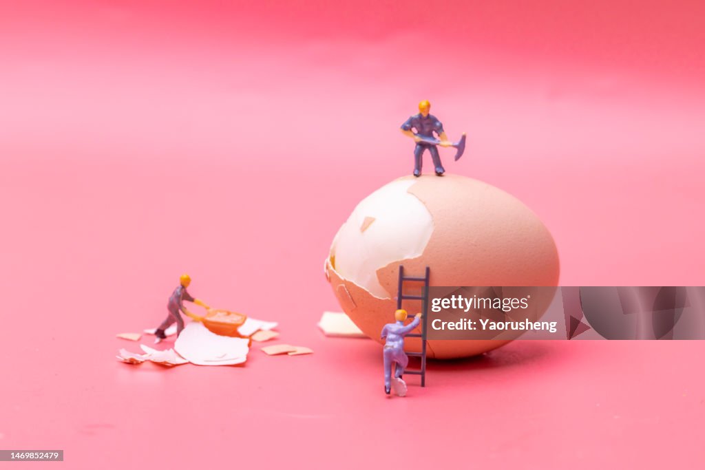 Figurines work hard on the egg