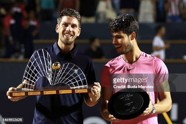 Cameron Norrie of Great Britain poses for photographers with Carlos Alcaraz of Spain after winning the final match of ATP 500 Rio Open presented by...