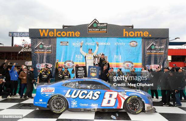 Kyle Busch, driver of the Lucas Oil Chevrolet, celebrates in victory lane after winning the NASCAR Cup Series Pala Casino 400 at Auto Club Speedway...