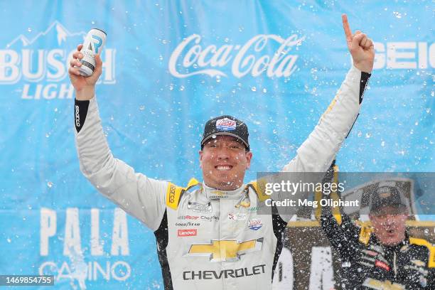 Kyle Busch, driver of the Lucas Oil Chevrolet, celebrates in victory lane after winning the NASCAR Cup Series Pala Casino 400 at Auto Club Speedway...