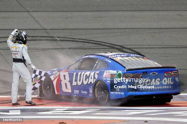 Kyle Busch, driver of the Lucas Oil Chevrolet, celebrates with the checkered flag after winning the NASCAR Cup Series Pala Casino 400 at Auto Club...