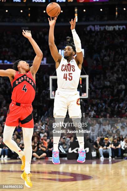 Donovan Mitchell of the Cleveland Cavaliers shoots over Scottie Barnes of the Toronto Raptors during the third quarter at Rocket Mortgage Fieldhouse...