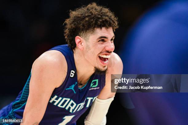 LaMelo Ball of the Charlotte Hornets looks on during their game against the Miami Heat at Spectrum Center on February 25, 2023 in Charlotte, North...