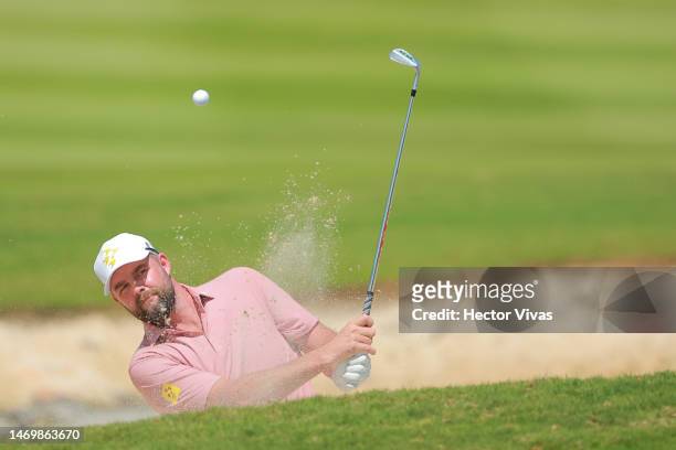 Marc Leishman of Ripper GC plays a shot from a bunker on the third hole during day three of the LIV Golf Invitational - Mayakoba at El Camaleon at...