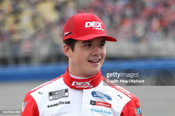 Harrison Burton, driver of the DEX Imaging Ford, waits on the grid prior to the NASCAR Cup Series Pala Casino 400 at Auto Club Speedway on February...