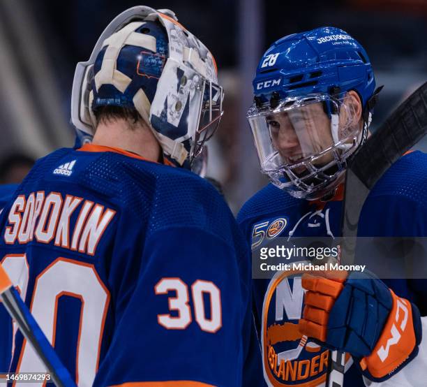 Alexander Romanov and Ilya Sorokin of the New York Islanders celebrate a victory against the Winnipeg Jets at UBS Arena on February 22, 2023 in...