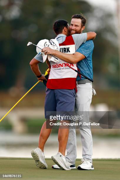 Chris Kirk of the United States is congratulated by his caddie on the 18th hole after winning the The Honda Classic at PGA National Resort And Spa on...